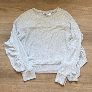 Cupcakes and Cashmere cropped sweater with ruffle detail.